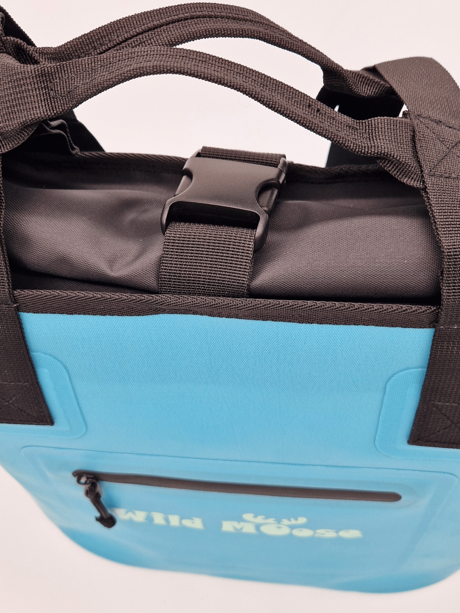 close up product shot  a bright blue tote bag with Wild Moose logo
